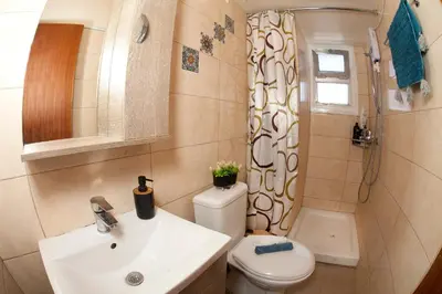 a bathroom with a sink and a toilet and a shower at ARTEMIS 3, Beachfront Boutique Apartment in Limassol