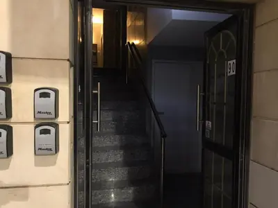 a stairway leading up to a door in a building at Alex Beach Apartment 34 in Larnaka