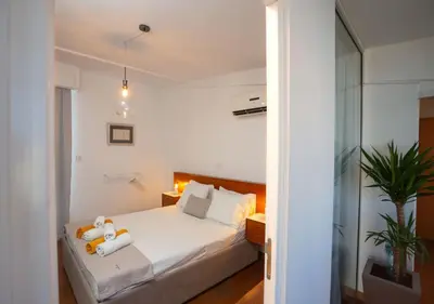 a bedroom with a bed with two teddy bears on it at 1-80 Collection Penthouse by TrulyCyprus in Limassol