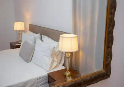 a bedroom with a bed with a mirror at 1-80 Collection Penthouse by TrulyCyprus in Limassol