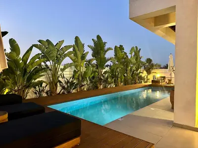 a swimming pool in the backyard of a house at Lora Pearl Luxury Villa in Protaras