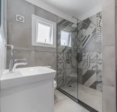 a bathroom with a sink and a shower at Lemon Tree Villa in Paralimni