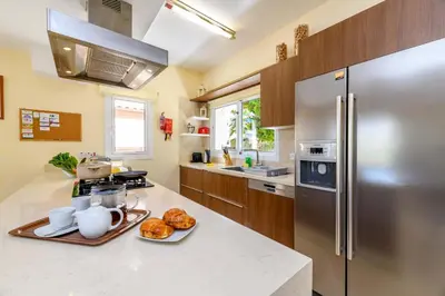 a kitchen with a stainless steel refrigerator and a counter top at Villa Alexander in Protaras