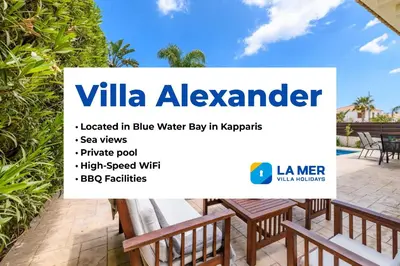 a sign for a villa alkender located in blue water water play in k at Villa Alexander in Protaras