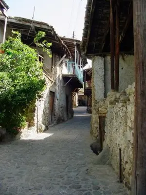 an alley in an old town with a building at The Mill Hotel in Kakopetria