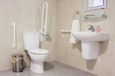 a bathroom with a toilet and a sink at I Plateia in Kalopanayiotis