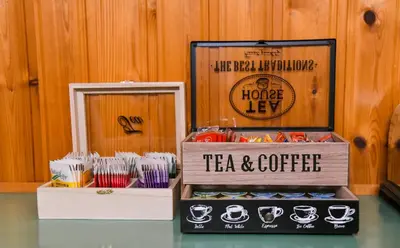 a table with a box of tea and coffee at Sophias Cottage in Askas