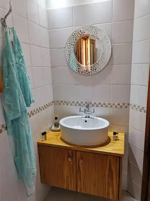a bathroom with a sink and a mirror at Unique Stonehouse Traditional Villa in Ayia Anna in Ayia Anna
