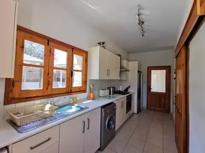 a kitchen with a sink and a dishwasher at Unique Stonehouse Traditional Villa in Ayia Anna in Ayia Anna