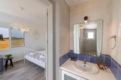 a bathroom with a sink and a mirror at Ayia Napa Marina Vibes in Ayia Napa
