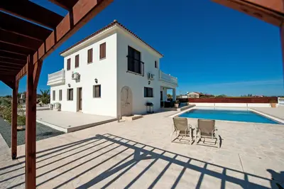 a view of a villa with a swimming pool at Amani Villa in Protaras