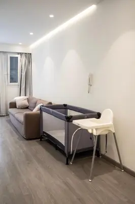 a room with a bed and a table and a chair at City Centre Studio Apartments Nicosia in Nicosia