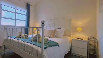 a bedroom with a white bed with teddy bears on it at STAY Downtown Retreat in Limassol