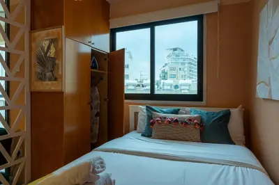 a small bedroom with a bed and a window at Johny's Spot in Larnaca in Larnaka