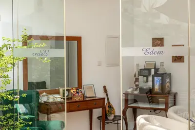 a room with a table and a glass wall at Edem Traditional House in Larnaka