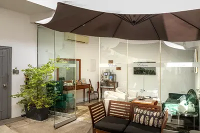 a living room with a couch and an umbrella at Edem Traditional House in Larnaka