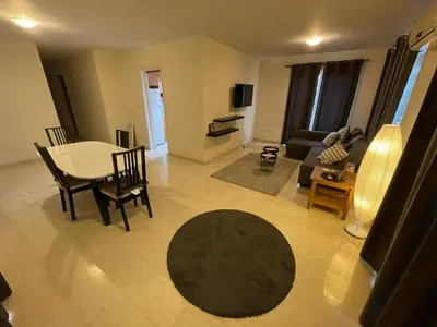 a living room with a table and a couch at 3Bdr in Nicosia in Strovolos