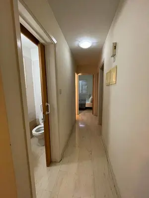 a hallway of a bathroom with a toilet in it at 3Bdr in Nicosia in Strovolos