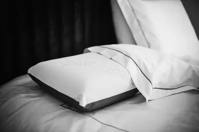 a white pillow sitting on top of a bed at New Leventis Luxury Κing Suite 41-Central Location in Ayia Napa