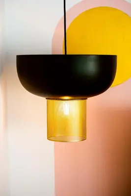 a black and yellow light fixture hanging from a wall at New Leventis Luxury Κing Suite 41-Central Location in Ayia Napa