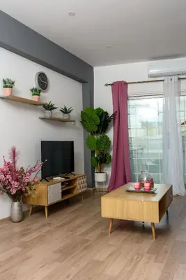 a living room with a tv and a table at Valdivian Flat 18 in Larnaka