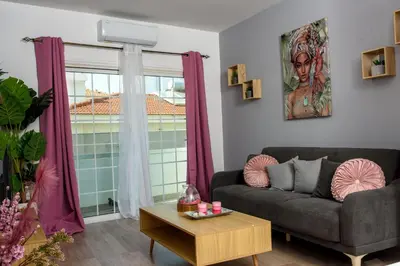 a living room with a couch and a window at Valdivian Flat 18 in Larnaka