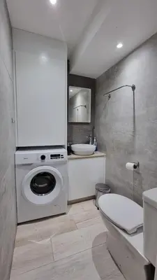 a bathroom with a washing machine and a sink at Nagia’s Apartment in Kakopetria