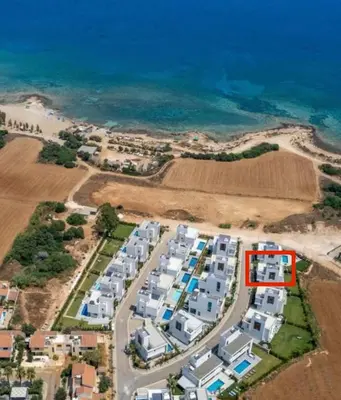 an aerial view of an apartment complex next to the ocean at By the Beach Villa Natalya in Protaras