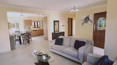 a living room with a couch and a table at STAY Ocean View Villa in Paralimni
