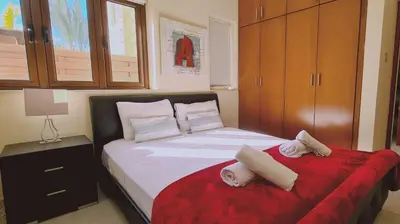 a bedroom with a bed with towels on it at STAY Ocean View Villa in Paralimni
