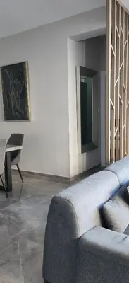 a living room with a couch and a table at Hanna Panorama Villa in Protaras