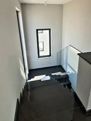 a room with a glass staircase with a window at Hanna Panorama Villa in Protaras