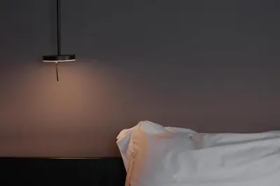a bedroom with a white bed and a lamp at The Sendal Boutique Hotel in Nicosia