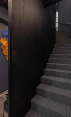 a staircase in a building with a black wall at The Sendal Boutique Hotel in Nicosia