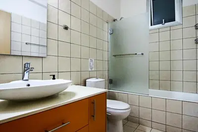 a bathroom with a sink and a toilet at Phaedrus Living City View Luxury Flat Harbour 04 in Larnaka