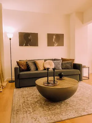 a living room with a couch and a coffee table at Newly Renovated Super-Chic Apartment in Nicosia