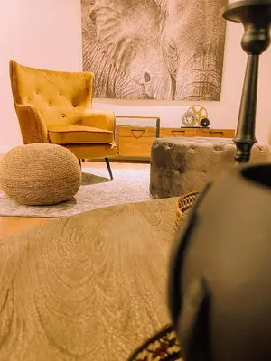 a living room with a chair and a couch at Newly Renovated Super-Chic Apartment in Nicosia