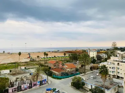 an aerial view of a city with a beach at Panoramic Seaside Getaway, 2-BR Penthouse in Larnaka