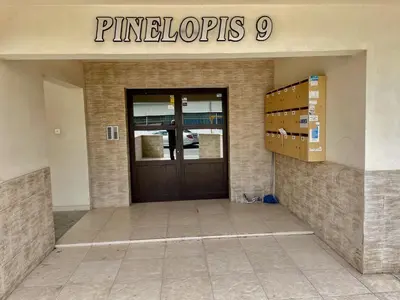 a front door of a pharmacy with a sign on it at Cyprus Penelope in Larnaka