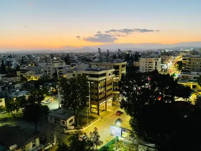 a view of a city at night at Lina 703 in Larnaka