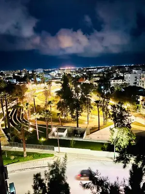 a view of a city at night with a street at Lina 703 in Larnaka