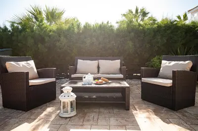 two chairs and a coffee table on a patio at Protaras View Villas in Protaras