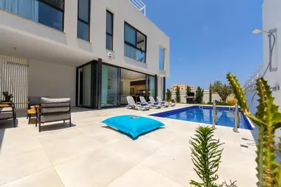 a villa with a swimming pool and a house at Protaras Almaria Villa 16 in Protaras