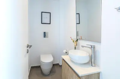 a bathroom with a sink and a toilet at Protaras Almaria Villa 16 in Protaras