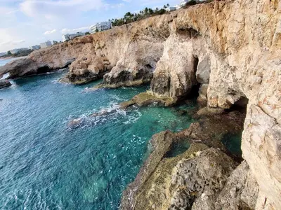 an aerial view of a rocky shore with the ocean at Villa - Sleeps 6 free parking & heated pool in Protaras