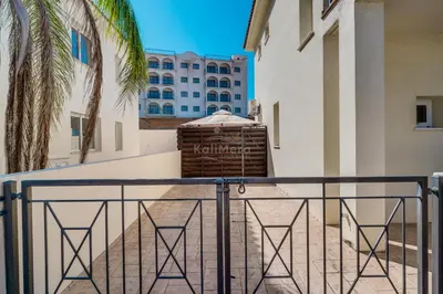 a balcony with a fence and a building at Villa Emily in Protaras