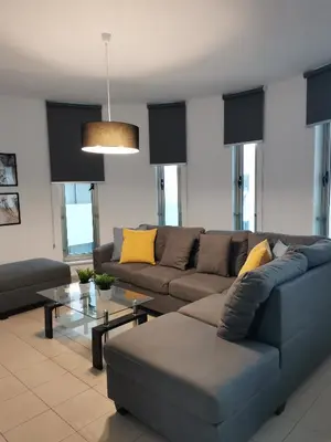 a living room with a couch and a table at City Flats 308 in Larnaka