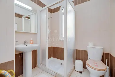 a bathroom with a shower and a toilet and a sink at Villa Hanna in Protaras