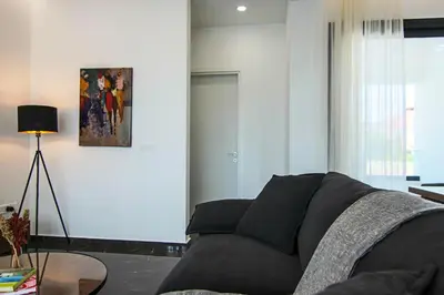 a living room with a couch and a table at Phaedrus Living: City View Anna Residence 101 in Limassol