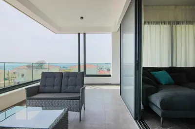 a living room with a couch and a table at Phaedrus Living: City View Anna Residence 102 in Limassol